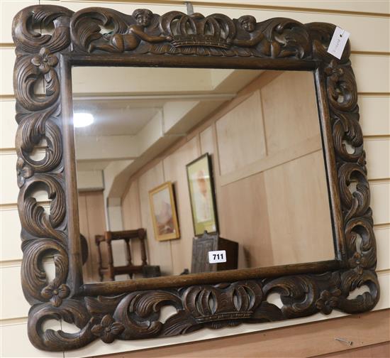 A Carolean style oak framed mirror, W.72cm